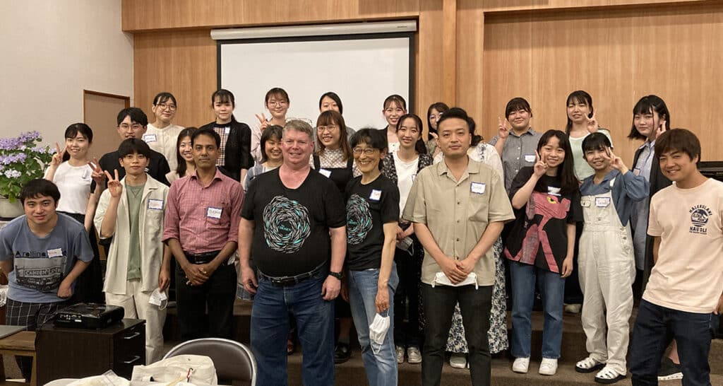 Marc and Yumiko Leis standing with a group of Christians in Japan