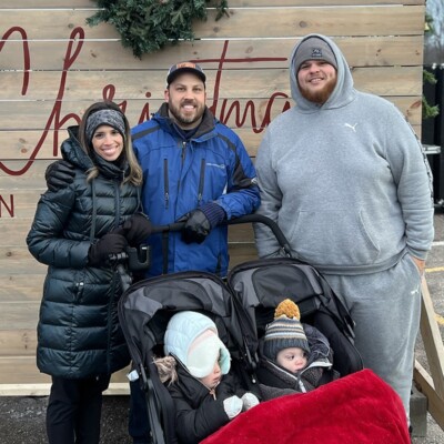 Jon and his wife and two young kids stand with Matt outside.