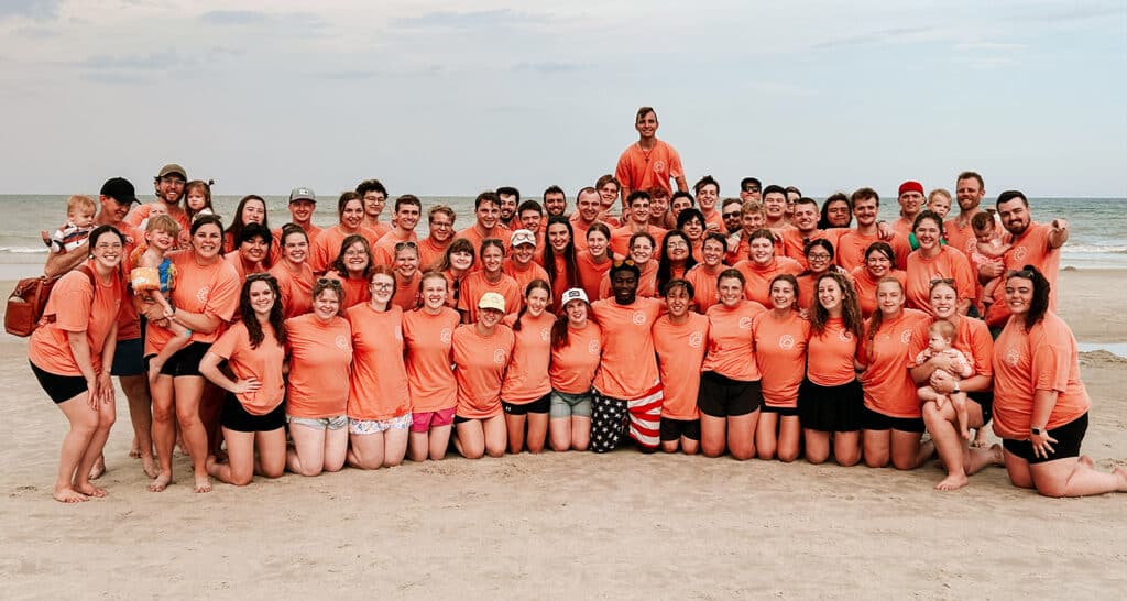 Students pose for a picture on a Jacksonville Beach.