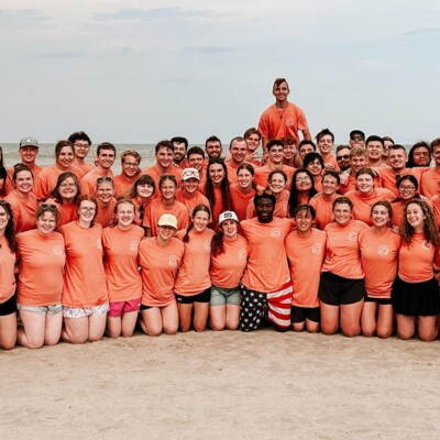 Students pose for a picture on a Jacksonville Beach.
