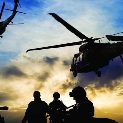 Reaching the Next Generation of Disciplemakers in the Marine Corps | The Navigators Military | Silhouettes of soldiers during Military Mission at dusk