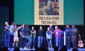 A team leads worship on stage at The Navigators National Staff Gathering.