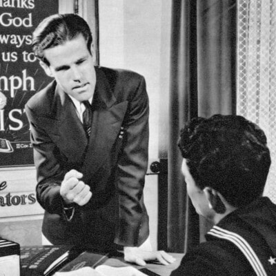 Dawson Trotman speaking to a young sailor about The Navigators.