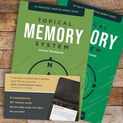 Picture of the Topical Memory System (scripture memorization resource) on a wooden desk